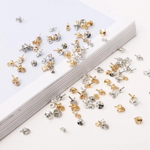 Detailed view of bulk gold and silver screw eye pins for jewelry DIY handmade projects