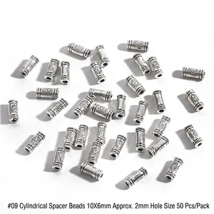 Makroaufnahme von 10x6mm Altsilber-Zylinderperlen mit Sonnenblumenrelief für DIY-Schmuck