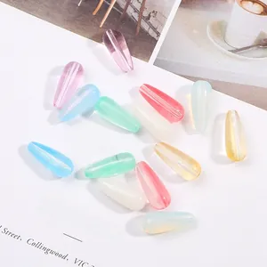 Macro view of colorful translucent teardrop glass beads for DIY hairpins and jewelry