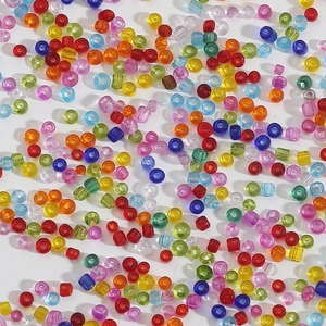 Macro shot of 2-4mm transparent multi-color glass seed beads for DIY jewelry making
