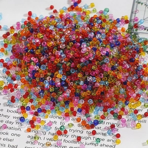 Macro shot of 2-4mm transparent colorful glass seed beads for DIY jewelry making