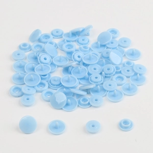 Detailed components of light blue resin snap fasteners for children's clothing DIY projects