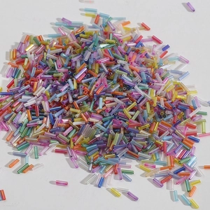 Macro detail of mixed color glass bugle beads for DIY embroidery and jewelry crafts