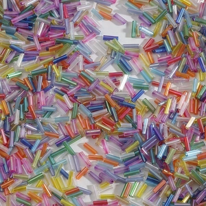 Close-up of colorful iridescent glass bugle beads for DIY jewelry and embroidery work