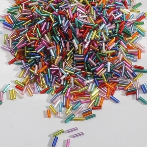 Macro shot of colorful glass bugle beads for DIY jewelry and wedding dress accessories