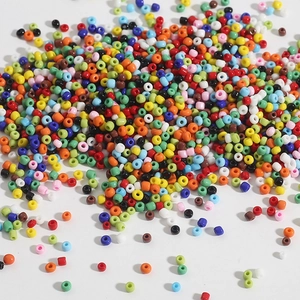 Macro view of multi-colored round glass seed beads for DIY jewelry and crafts