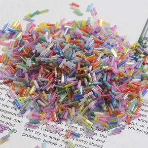 Colorful glass bugle beads for DIY embroidery and jewelry making in various vibrant colors