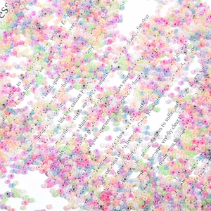 Macro shot of colorful pastel macaron seed beads for DIY jewelry and beaded crafts