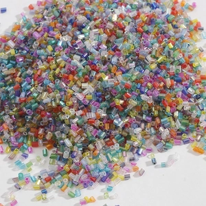 Macro view of colorful 2mm bugle beads for DIY jewelry making and handmade accessories