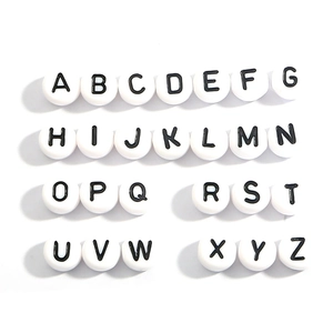 Flat lay of white acrylic round alphabet beads A-Z for DIY jewelry making kits