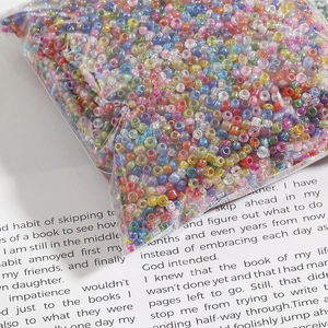 Colorful iridescent glass seed beads for DIY jewelry making in clear bulk packaging