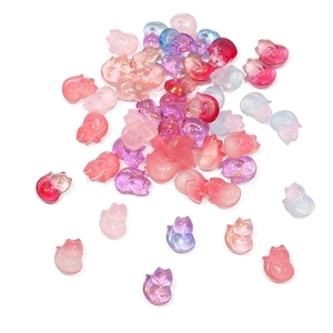 Detail of gradient glass fox beads with gold glitter for DIY traditional hairpins
