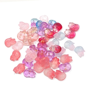 Macro shot of colorful fox-shaped gradient glass beads for DIY hairpins and jewelry making