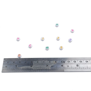 Colorful 7mm acrylic letter beads for DIY bracelets and necklaces shown with scale ruler