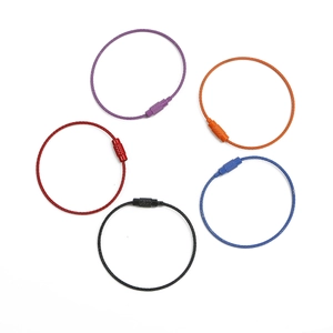 Macro detail of five colorful nylon-coated steel wire keychains with twist lock screw connectors