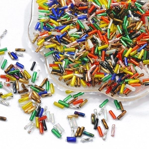 Macro shot of colorful glass bugle beads for jewelry making and embroidery craft