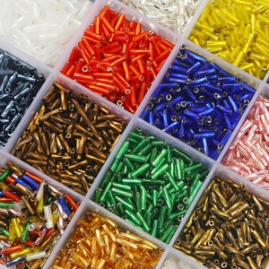 Colorful glass bugle beads set in a clear organizer for DIY jewelry and sewing projects