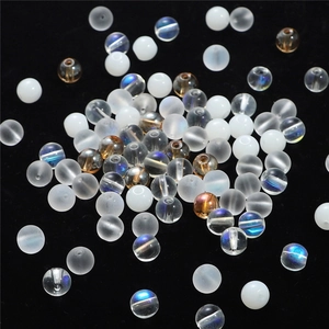 Mix of matte white, iridescent blue, and amber crystal round beads for DIY jewelry making