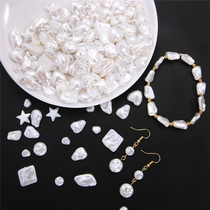 Macro shot of assorted baroque ABS pearl charms for DIY jewelry making and earrings