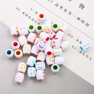 Macro shot of assorted colorful acrylic smile face cylinder beads for DIY jewelry making