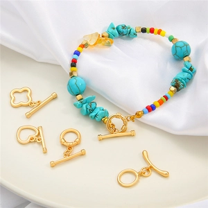 Handmade beaded bracelet with turquoise stones and varied gold toggle clasps set