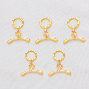 Detailed close-up of five 18K gold-plated OT toggle clasps for jewelry making