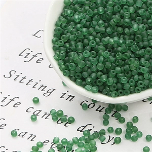 Macro detail of dark green matte seed beads for DIY jewelry and beaded crafts