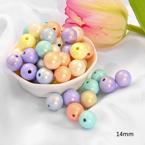 Macro shot of 14mm iridescent acrylic beads in pastel colors for DIY jewelry making