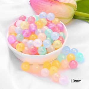 Close-up of 10mm pastel acrylic round beads with frosted texture for DIY jewelry crafts