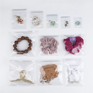 Detailed view of clear PVC self-sealing bags with hanging holes for jewelry storage