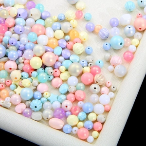 Mix of pastel acrylic beads in star and round shapes for DIY jewelry making
