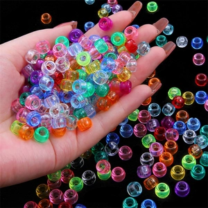 Close-up of colorful translucent acrylic pony beads with large holes for DIY jewelry