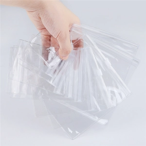 Detail view of transparent PVC waterproof slider bags with white zippers for jewelry storage