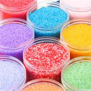 Colorful mix of round seed beads in plastic jars for DIY necklace and earring crafts