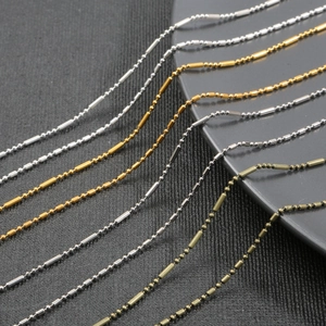 Detailed macro view of iron olive bead and bamboo joint chains for DIY jewelry making