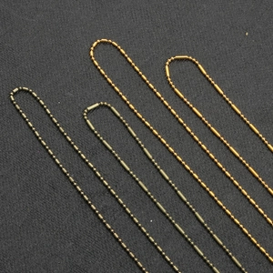 Detail of DIY bead and bar chain in gold and antique bronze for hair accessories