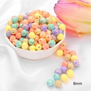 Macro shot of 8mm faceted acrylic beads in pastel macaron colors for DIY jewelry making