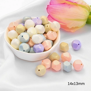 Detail of 14x13mm geometric acrylic beads in pastel macaron colors for DIY jewelry making