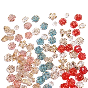 Mixed DIY acrylic beads collection with golden-edged flowers and resin butterflies