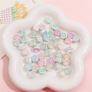 Detail of heart and star DIY charms in pastel macaron colors for handmade jewelry