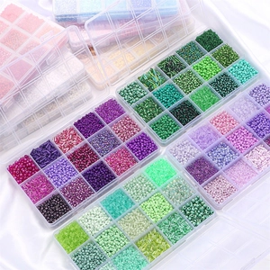 DIY bead set with multi-color glass seed beads and tubes in transparent organizer box