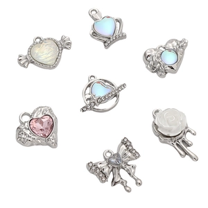 Silver alloy charms with melted rose, heart planet, and diamond bow for DIY jewelry making