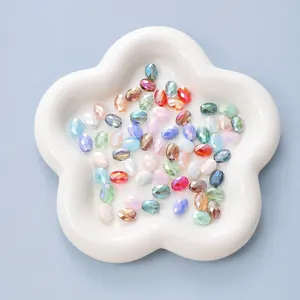 Detailed view of faceted oval crystal beads in various colors for DIY jewelry making