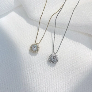 Close-up of S925 silver halo square pendant necklaces in gold and silver finishes