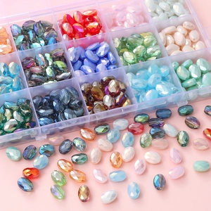 Flat oval faceted crystal glass beads in assorted colors with a clear storage box