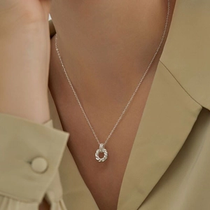 Elegant 925 sterling silver Mobius twist pendant necklace worn on a female model