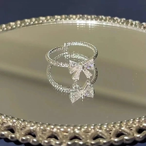 Detailed view of the S925 silver bow ring with zircon stones and twisted rope texture