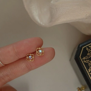 French style S925 sterling silver hollow clover stud earrings with light blue gemstone