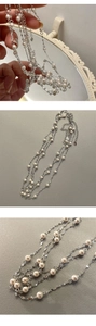 Macro shot of S925 sterling silver chain with elegant white pearls and logo tag details