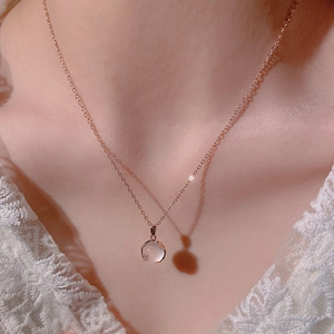 Close-up of S925 silver rose gold necklace with a round pink chalcedony stone